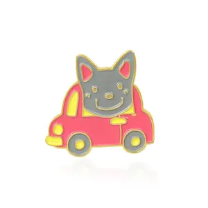 Detailed view of an enamel cartoon grey puppy driving a pink car pin with gold edges