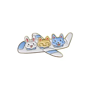 Detailed close-up of a cartoon airplane enamel pin with cute animals and gold edges