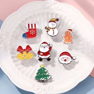 Set of 7 colorful Christmas enamel pins featuring Santa, tree, and snowman on a white plate