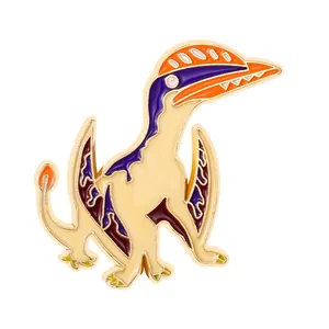Detailed close-up of a colorful enamel pterosaur brooch pin with vibrant gold edges