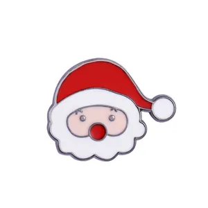 Close-up of Santa Claus enamel brooch with vibrant red hat and white beard details