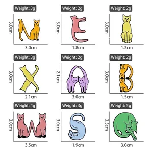 Set of 9 cute cartoon cat enamel pins in alphabet shapes for clothing and bag decoration