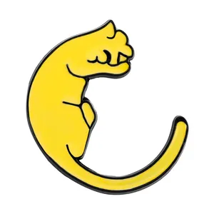 Detailed view of a yellow enamel cat lapel pin with black metal edges on white background