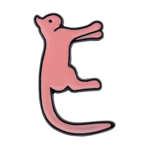 Macro detail of a pink enamel cat brooch in the shape of alphabet letter E with metal outlines