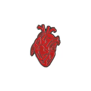 Red anatomical heart enamel brooch with medical anatomical terms and metal outlines