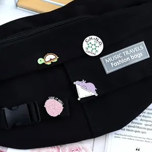 Black canvas waist bag decorated with cute science-themed turtle and hippo enamel pins