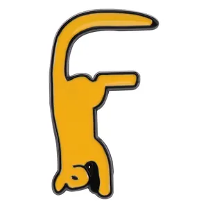 Detail of yellow enamel kitten brooch in F-shape letter design for bags and clothes