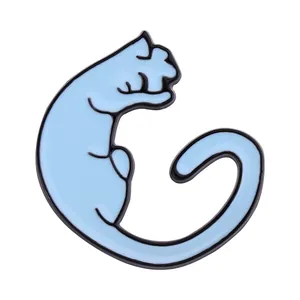 Detail of light blue enamel cat brooch with black outlines and smooth metal finish