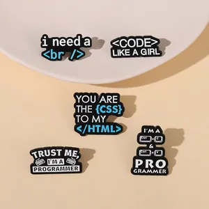 Set of 5 programmer enamel pins with HTML, CSS, and coding humor icons on beige background