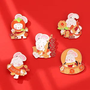Set de cinq épingles émaillées avec motifs de lapin festifs et slogans motivants