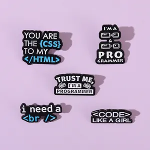 Detail of five creative black enamel pins for programmers with coding jokes and computer terms
