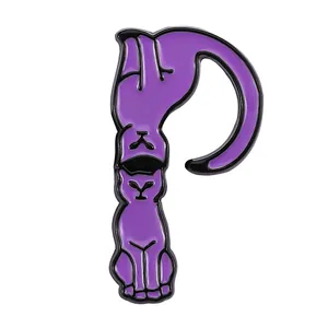 Detail of letter P enamel pin featuring two cute purple cats for bags and clothing