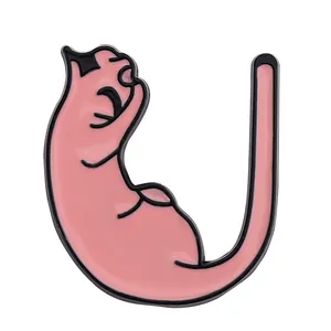 Detail of a pink enamel cat brooch with black outlines and flexible body shape