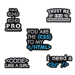 Detail of 5-piece programmer enamel pins set featuring CSS HTML coding and keyboard shortcuts