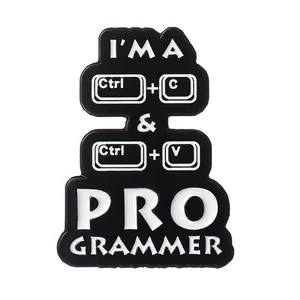 Macro shot of Ctrl+C and Ctrl+V keyboard shortcut enamel badges with sleek black finish