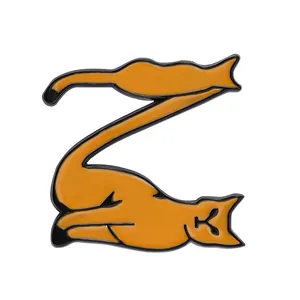 Detailed view of an orange Z-shaped cat enamel pin made of polished alloy metal