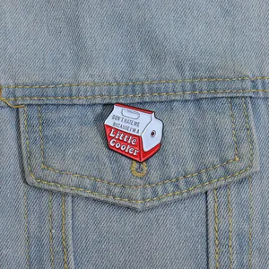 Creative milk box enamel brooch with cooler lettering on light blue denim jacket