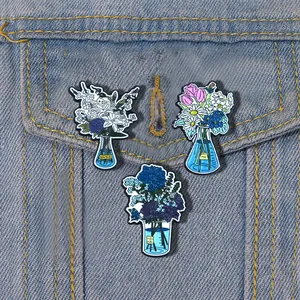 Detailed view of three floral enamel pins on denim pocket featuring bottles and vases