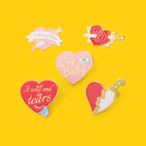 Set of 5 enamel lapel pins with red rose, dagger, and heart designs in American pop art style