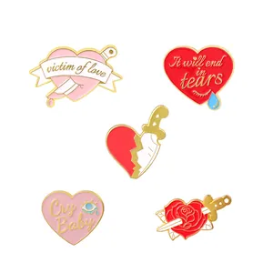 Detailed set of five enamel heart brooches with daggers and gothic romantic quotes