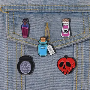 Detail of 5pcs gothic magic potion enamel pins set styled on a denim jacket pocket