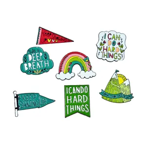 Set of 7 inspirational enamel pins featuring motivational quotes in various shapes and colors