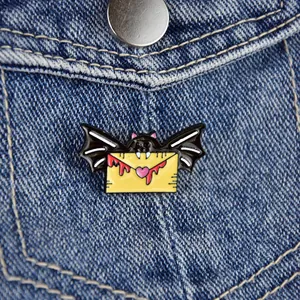 Bat with envelope enamel pin badge on blue denim pocket for Halloween bag accessories