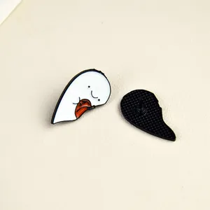 Ghost enamel pin badge with heart shape and orange details, front and back view