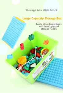 Green storage box for building blocks with a blue baseplate lid for DIY toy organization