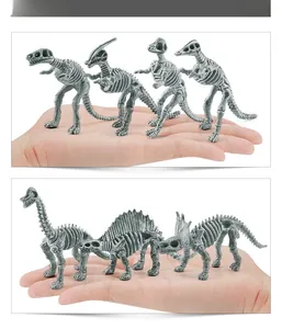 Miniature grey dinosaur skeleton fossil models shown in hand to illustrate the actual size