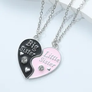 Big Little Sister split heart pendant necklaces with crystals and pink black enamel finish
