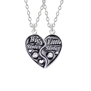 Big Little Sister heart pendant necklace set with black enamel and white crystals