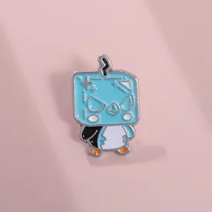 Close-up of blue cartoon penguin enamel pin with square head and lightning star details