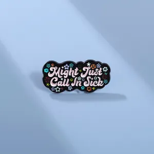 Detail of Might Just Call In Sick black enamel badge with pink letters and stars