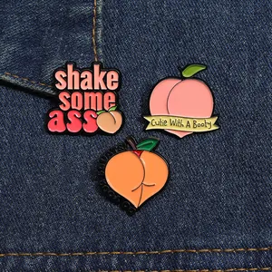 Detailed set of peach enamel pins featuring humorous fitness slogans on blue denim fabric