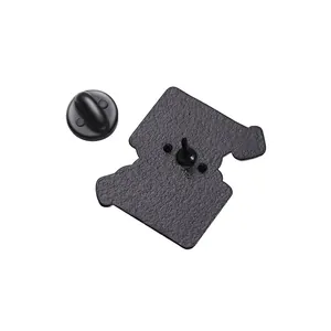 Detail view of matte black alloy brooch back pin with matching secure rubber clutch