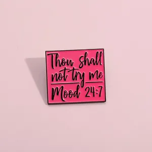 Detail of square pink enamel pin with black engraving Thou shall not try me Mood 24:7
