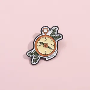 Compass enamel brooch with Jeremiah 29:11 scripture and green feather leaf accents