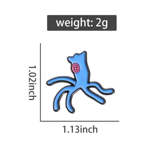 Cartoon enamel pin with blue creature and pink button eyes showing 1.02x1.13 inch size