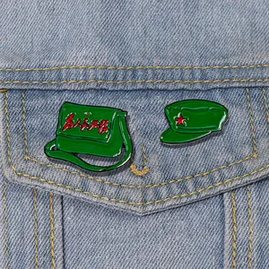 Retro 1960s green army bag and cap enamel pins set with red star on denim jacket