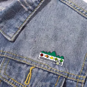 Close-up of sliding weather mood enamel pin on blue denim jacket pocket