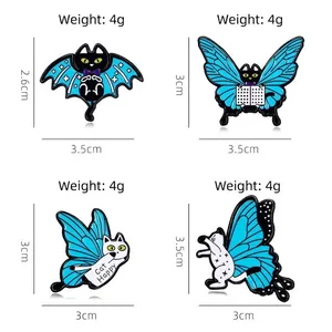 Cartoon enamel cat pins set featuring butterfly wings and books on white background