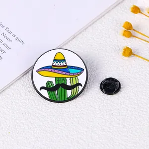 Detail of round enamel cactus pin with Mexican hat and secure rubber clutch back