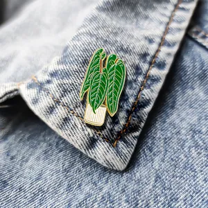 Creative enamel potted plant brooch with green leaves pinned on denim jacket lapel