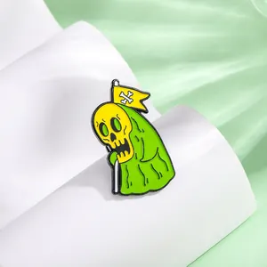 Cartoon skeleton ghost in green cloak enamel pin on white stand with green background