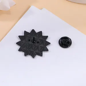 Back view of black star-shaped zinc alloy brooch badge with metal butterfly clutch