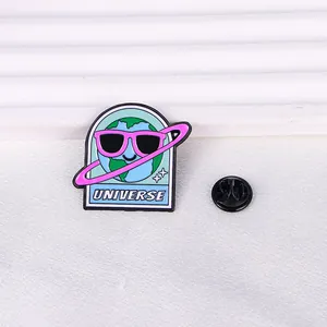 Detailed close-up of Earth enamel pin with UNIVERSE text and rubber butterfly back