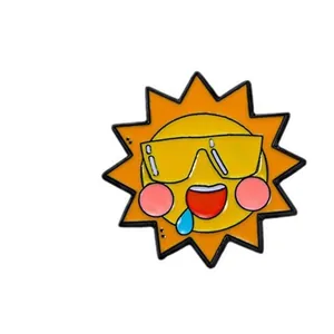 Cartoon sun enamel brooch with sunglasses and playful expression in bright yellow and orange