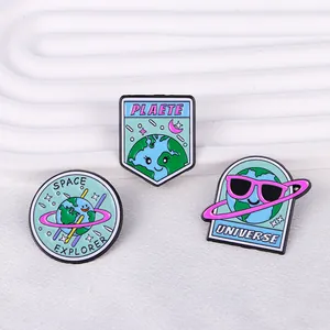 Three cute space explorer enamel pins set featuring cartoon Earth and universe motifs