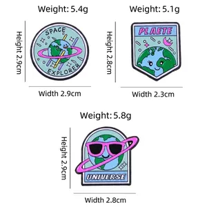 Space-themed enamel Earth pins set with Planet and Universe lettering and dimensions